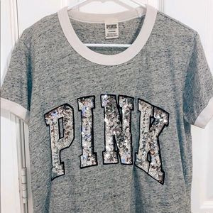 A pink brand gray T-shirts with sequins on it!